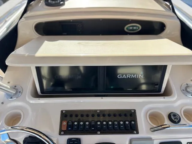 Get Hot Yacht Photos Pics 2011 Grady-White Canyon 306 dashboard with Garmin navigation system.