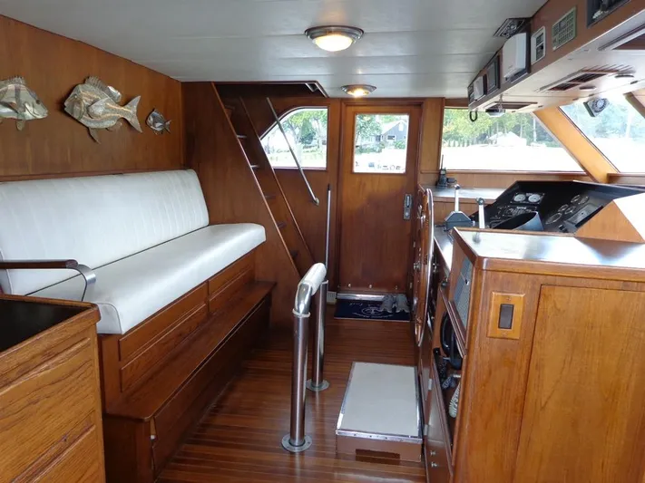  Yacht Photos Pics 1988 Burger 80 Motor Yacht interior with wood paneling and seating.