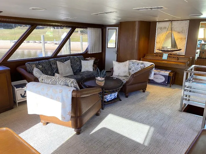  Yacht Photos Pics Luxurious interior of 1988 Burger 80 Motor Yacht with elegant seating and nautical decor.