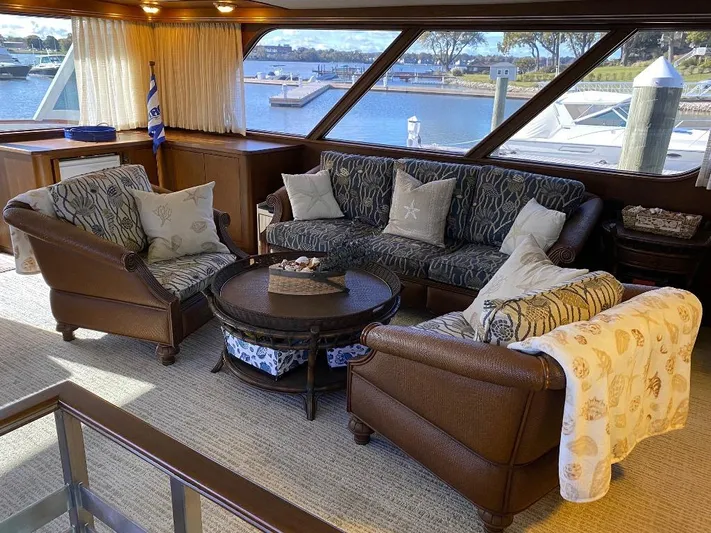  Yacht Photos Pics Luxurious interior of 1988 Burger 80 Motor Yacht with elegant seating and waterfront view.