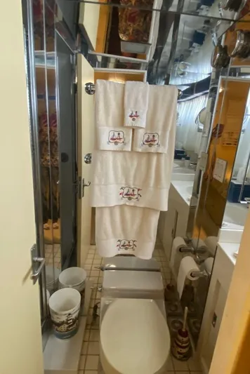  Yacht Photos Pics Bathroom interior of 1988 Burger 80 Motor Yacht with towels and modern fixtures.