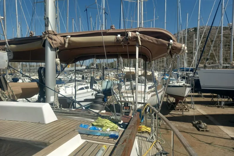  Yacht Photos Pics 1994 Siltala Nauticat 38 sailboat in a marina, surrounded by other boats.
