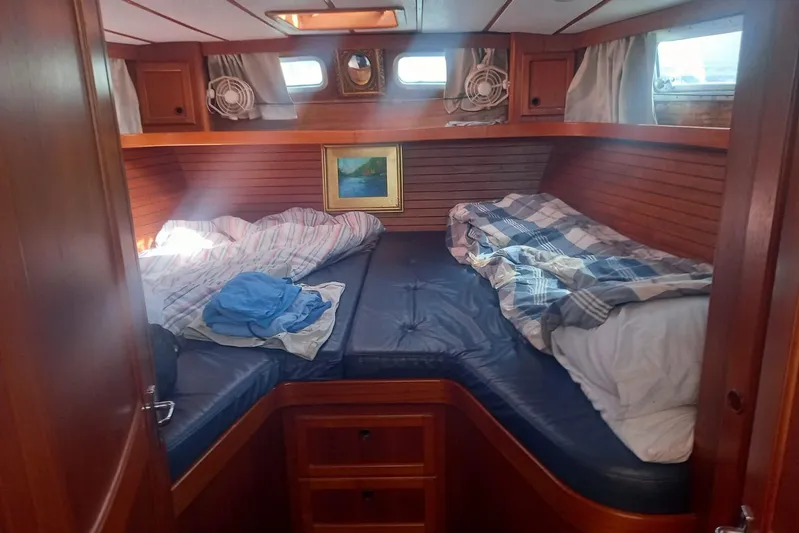  Yacht Photos Pics Cozy cabin interior of 1994 Siltala Nauticat 38 sailboat with twin beds and wooden paneling.