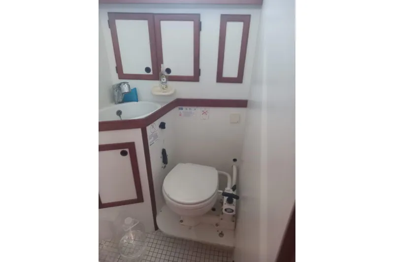  Yacht Photos Pics Bathroom interior of 1994 Siltala Nauticat 38 yacht, featuring sink and toilet.