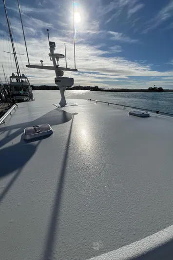 Tomahawk Yacht Photos Pics 2011 Flowers Hardtop boat deck under sunny sky.