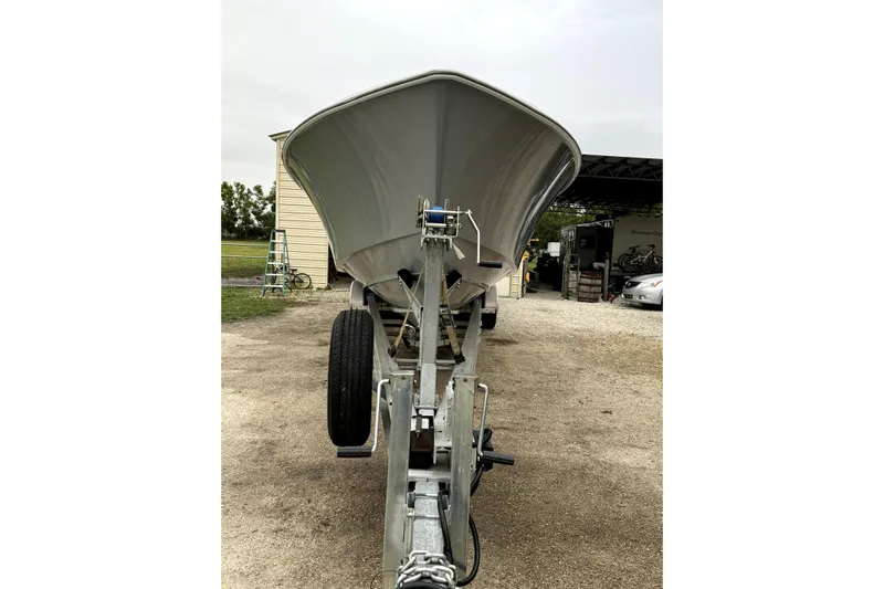  Yacht Photos Pics 2014 Contender 39 ST boat on trailer, parked outdoors near a building.