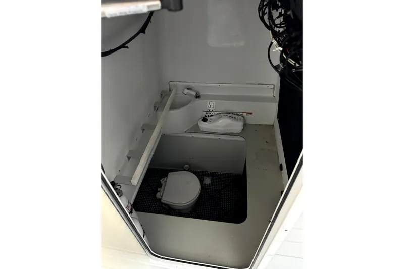  Yacht Photos Pics 2014 Contender 39 ST boat interior with compact marine toilet and sink.