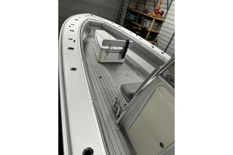  Yacht Photos Pics 2014 Contender 39 ST boat interior with seating and storage, docked in a garage.