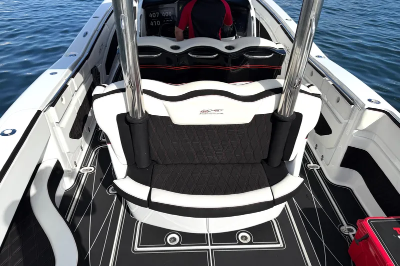 Fire Sale Yacht Photos Pics Luxury MTI V42 boat interior with black and white seating, 2019 model, on water.