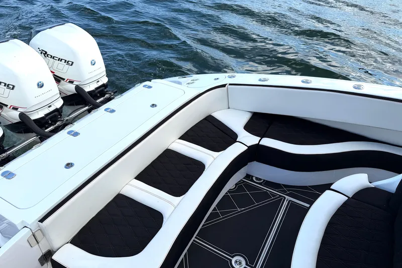 Fire Sale Yacht Photos Pics Luxury MTI V42 boat interior with twin outboard engines, 2019 model, on water.