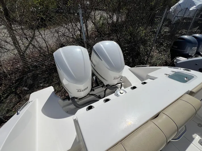  Yacht Photos Pics 2019 Pursuit S 288 Sport boat with twin outboard engines, rear view.