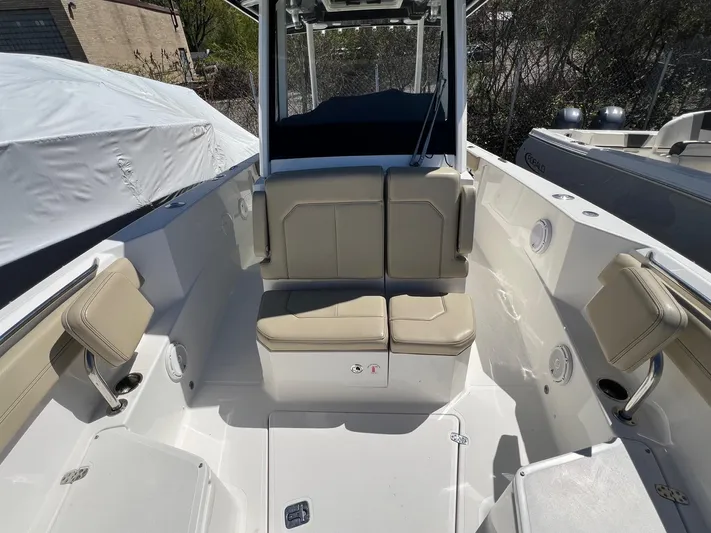  Yacht Photos Pics 2019 Pursuit S 288 Sport boat interior with beige seating and modern design.