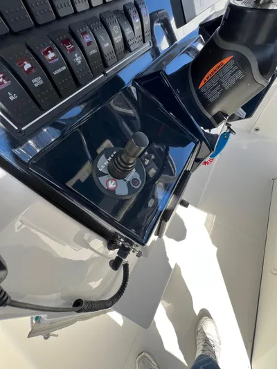 Yacht Photos Pics Control panel of a 2019 Pursuit S 288 Sport boat, featuring switches and joystick.