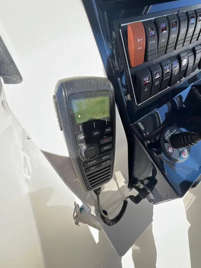  Yacht Photos Pics Control panel of 2019 Pursuit S 288 Sport boat with radio handset.