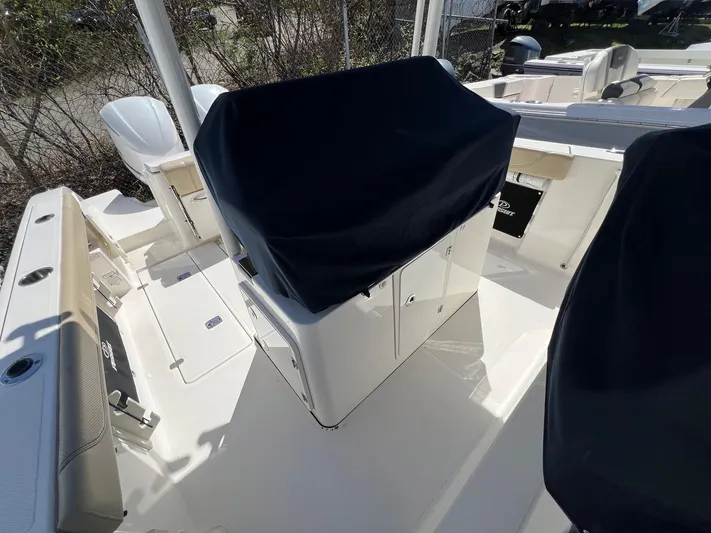  Yacht Photos Pics 2019 Pursuit S 288 Sport boat interior with covered console and seating.
