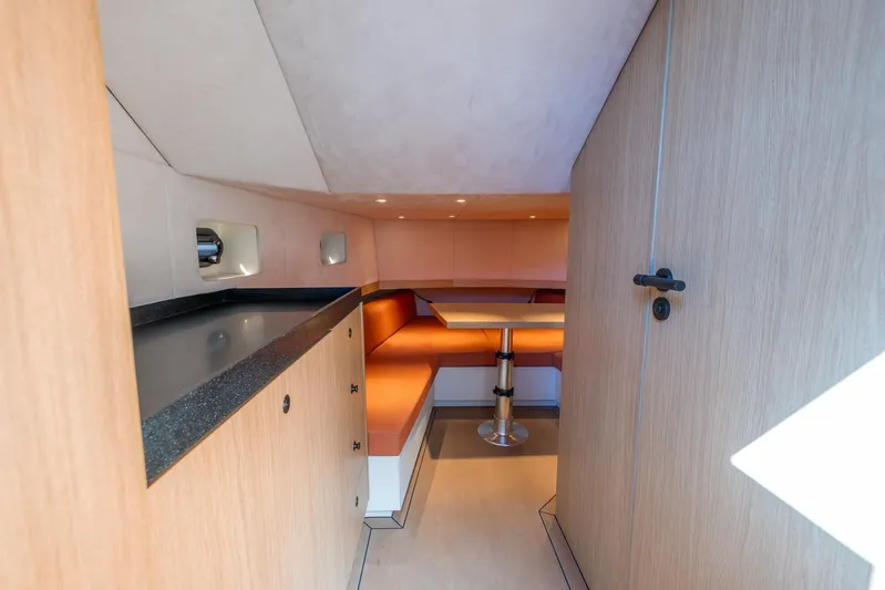  Yacht Photos Pics Modern interior of 2023 Lekker 44 yacht with cozy seating and sleek design.