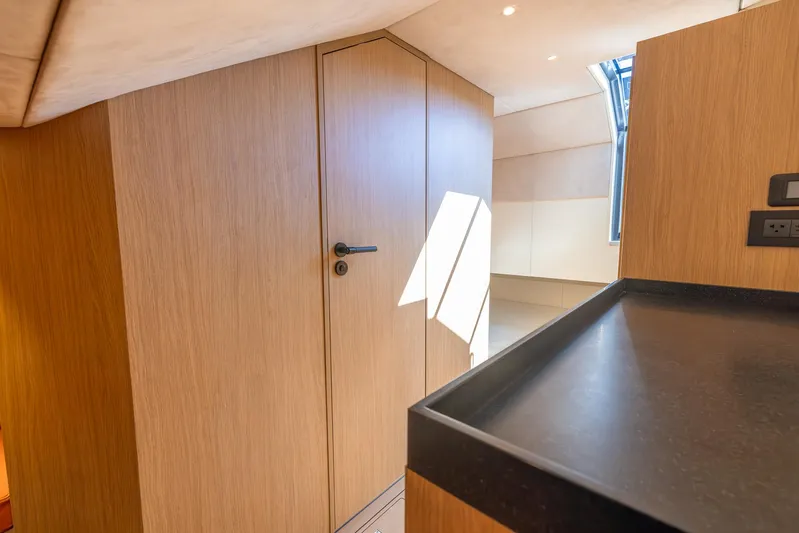  Yacht Photos Pics Modern interior of 2023 Lekker 44 yacht with sleek wood paneling and natural light.
