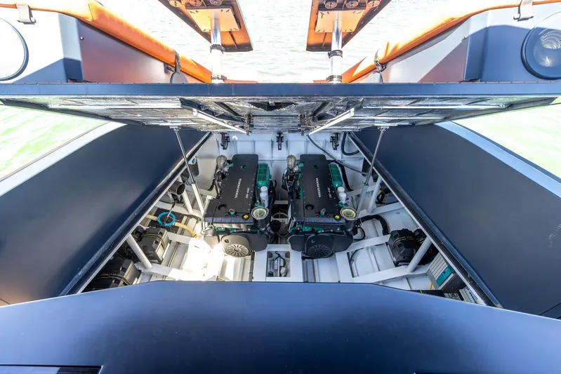  Yacht Photos Pics Engine compartment of 2023 Lekker 44 boat, showcasing dual engines and mechanical components.