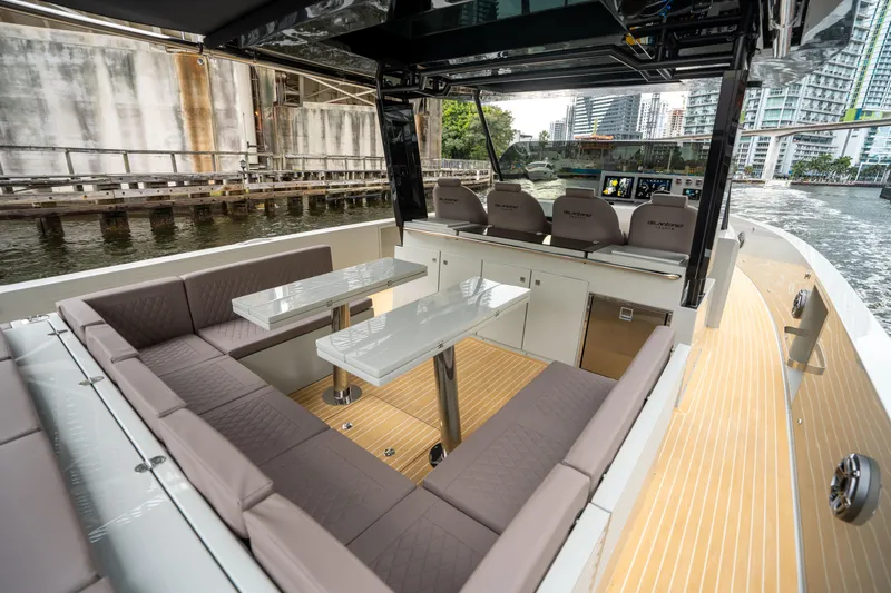  Yacht Photos Pics 2025 De Antonio Yachts D42 Open, luxurious seating, modern design, waterfront view.