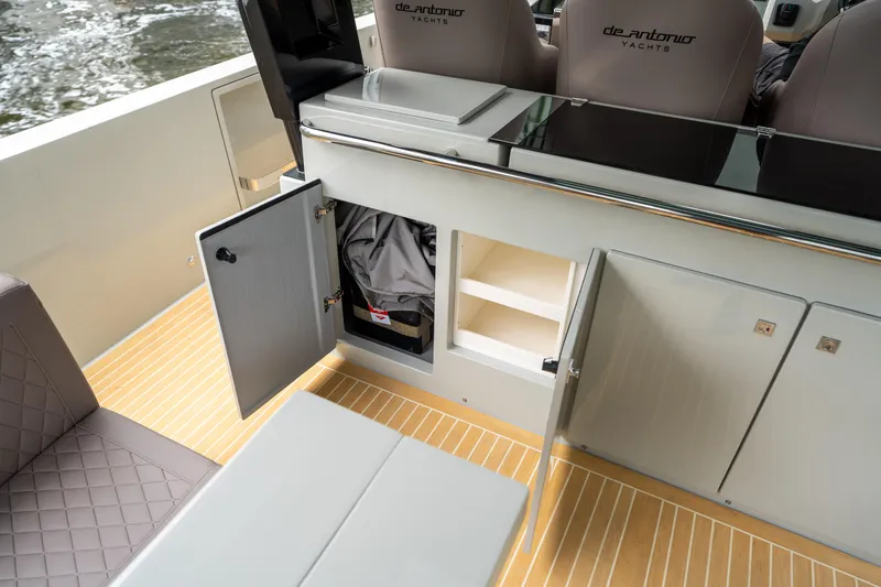  Yacht Photos Pics 2025 De Antonio Yachts D42 Open interior with open storage compartments and seating.