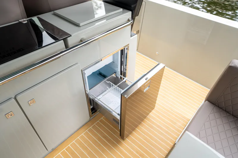  Yacht Photos Pics 2025 De Antonio Yachts D42 Open with open drawer fridge on deck.