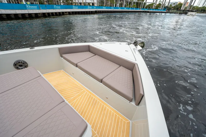  Yacht Photos Pics 2025 De Antonio Yachts D42 Open with cushioned seating and sleek deck design.