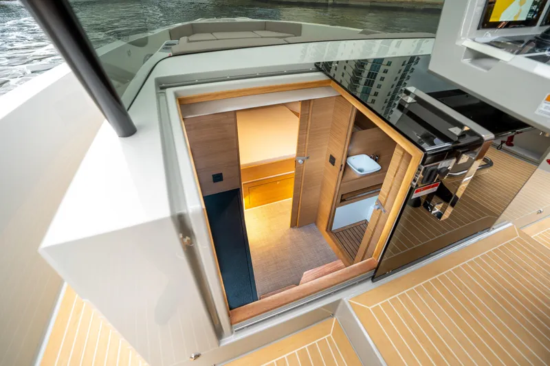  Yacht Photos Pics 2025 De Antonio Yachts D42 Open interior view, showcasing modern cabin entrance and sleek design.