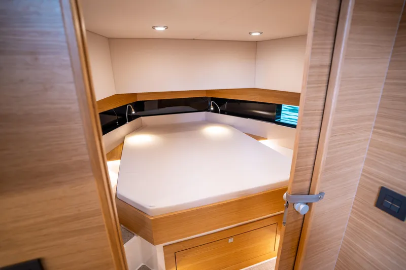  Yacht Photos Pics 2025 De Antonio Yachts D42 Open cabin interior with modern design and cozy lighting.