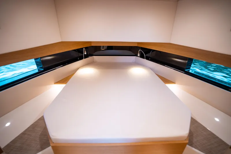  Yacht Photos Pics Luxurious interior cabin of 2025 De Antonio Yachts D42 Open, featuring a spacious bed.