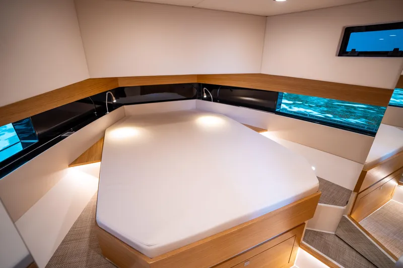  Yacht Photos Pics Luxurious cabin interior of 2025 De Antonio Yachts D42 Open, featuring modern design and ambient lighting.