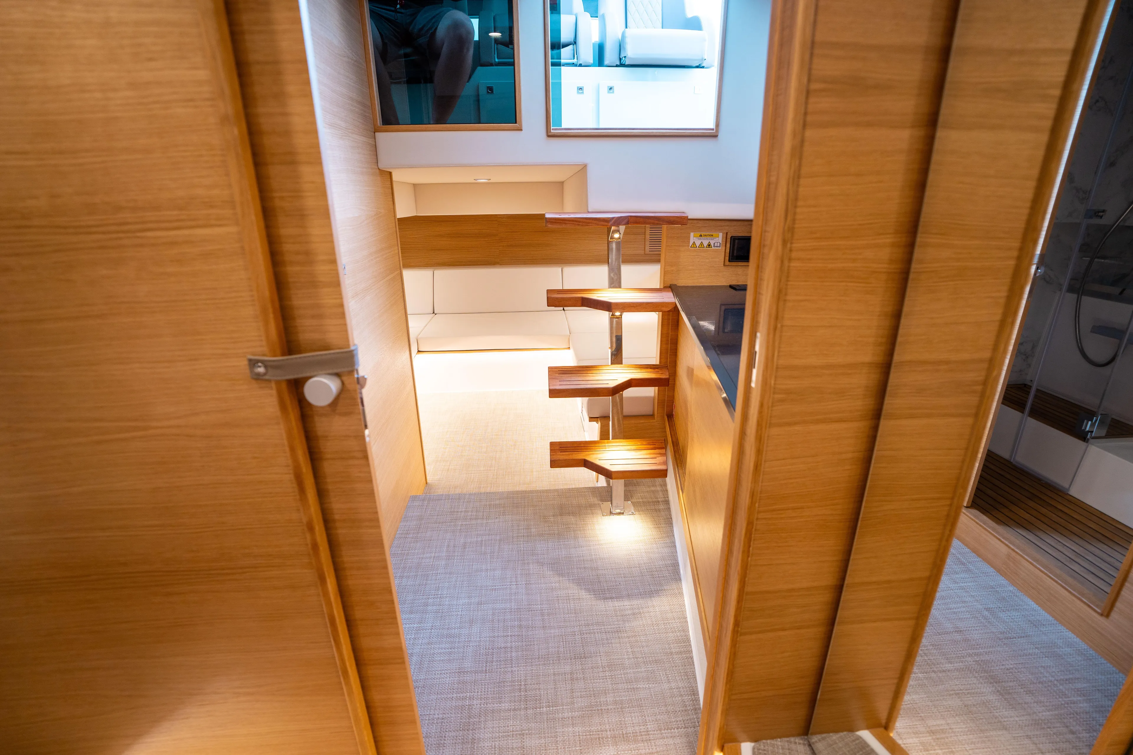  Yacht Photos Pics Interior of 2025 De Antonio Yachts D42 Open, featuring wooden stairs and modern design.