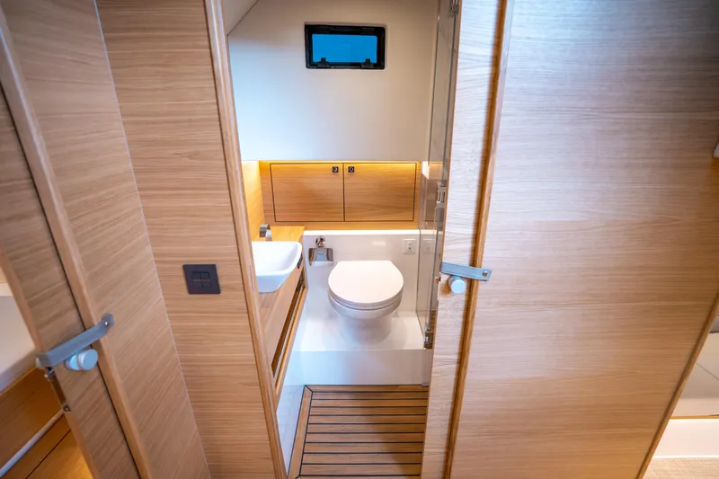  Yacht Photos Pics Luxurious bathroom interior of 2025 De Antonio Yachts D42 Open, featuring modern fixtures and wood accents.