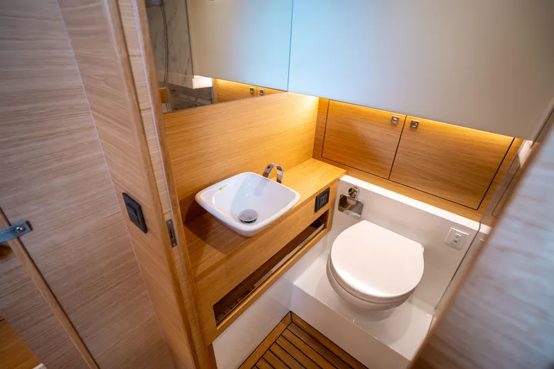  Yacht Photos Pics Luxurious bathroom in 2025 De Antonio Yachts D42 Open, featuring modern sink and toilet.