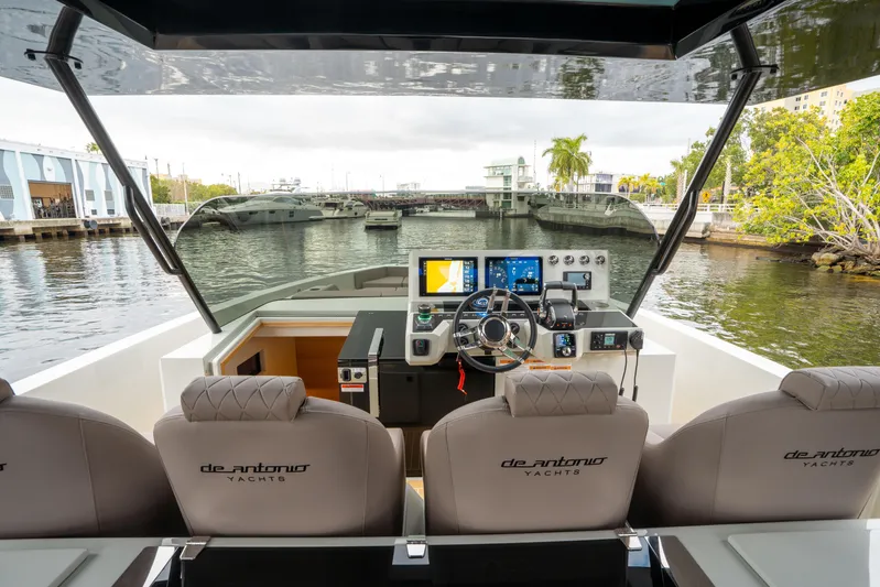  Yacht Photos Pics 2025 De Antonio Yachts D42 Open helm with modern controls and waterfront view.
