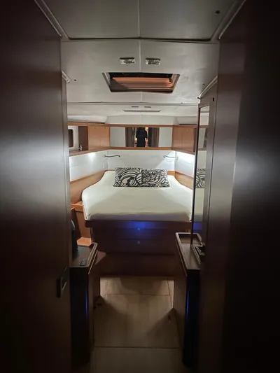  Yacht Photos Pics Luxurious cabin interior of 2015 Beneteau Sense 55 yacht with elegant bedding.