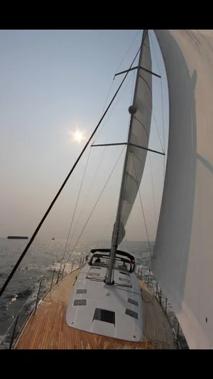  Yacht Photos Pics 2015 Beneteau Sense 55 sailing on open water under a clear sky.