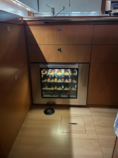  Yacht Photos Pics Wine cooler in the kitchen of a 2015 Beneteau Sense 55 yacht.