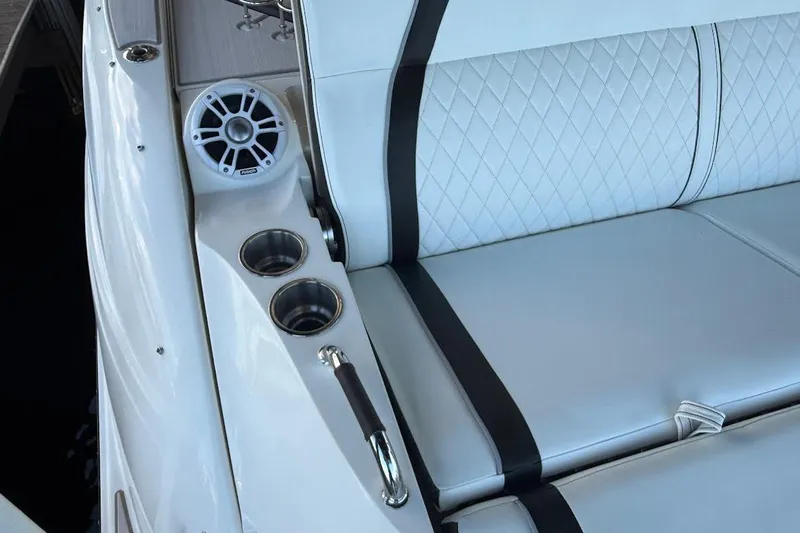 Manda Rae Too Yacht Photos Pics Luxurious 2018 Sea Ray 38SLV OB boat interior with white quilted seating and cup holders.