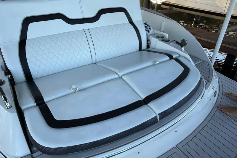 Manda Rae Too Yacht Photos Pics Luxurious seating on 2018 Sea Ray 38SLV OB boat, featuring white upholstery and black accents