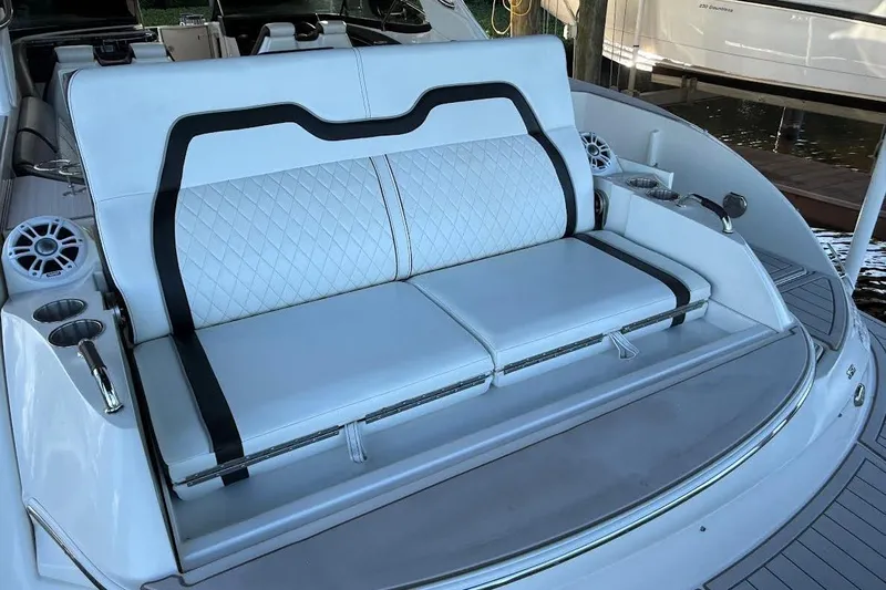 Manda Rae Too Yacht Photos Pics Luxury seating on 2018 Sea Ray 38SLV OB boat, featuring white upholstery and cup holders.