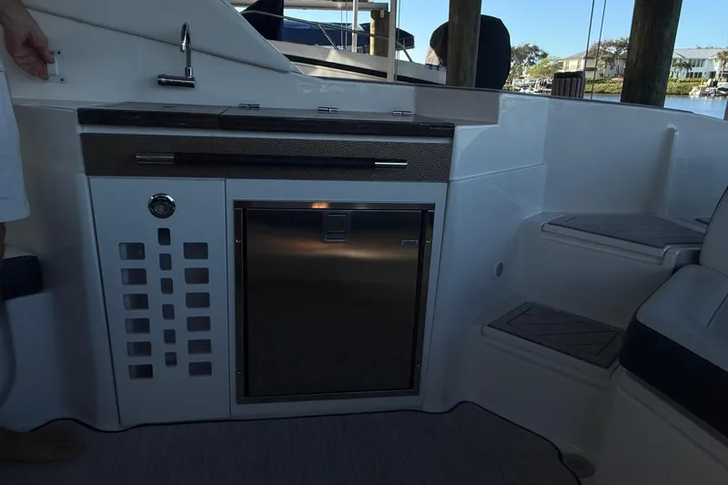 Manda Rae Too Yacht Photos Pics 2018 Sea Ray 38SLV OB boat interior with kitchenette and seating area.