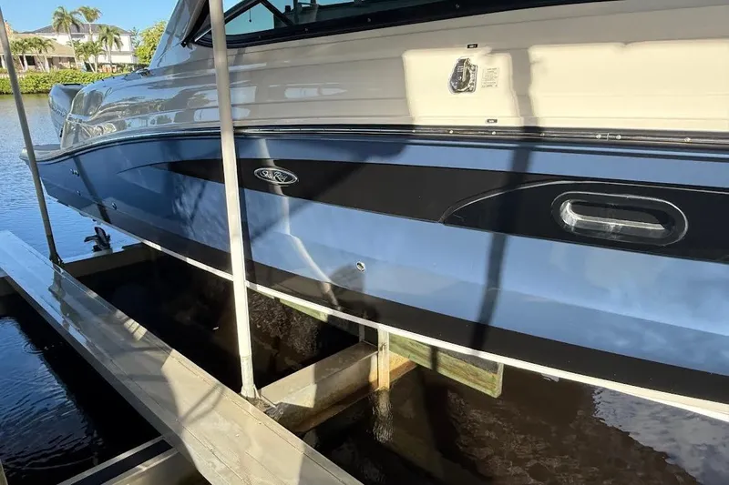 Manda Rae Too Yacht Photos Pics 2018 Sae Ray 38SLV OB boat docked on a sunny day.