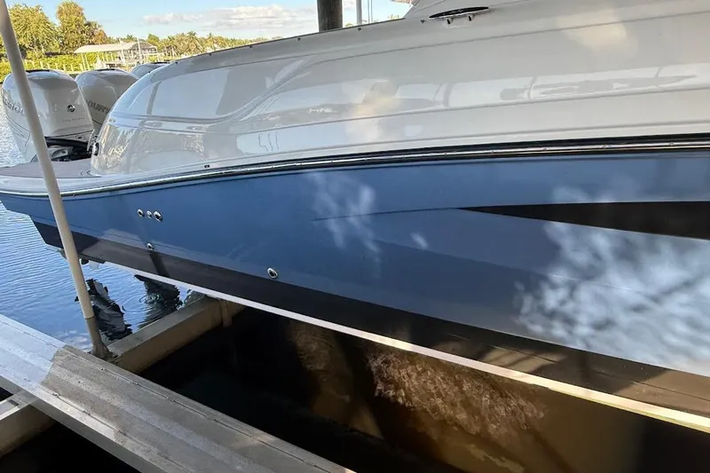 Manda Rae Too Yacht Photos Pics 2018 Sae Ray 38SLV OB boat docked, featuring sleek blue and white design.