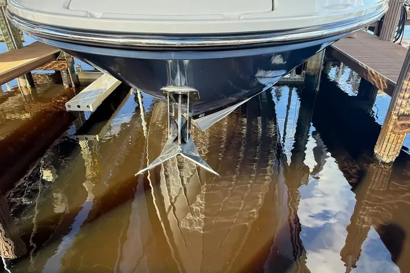 Manda Rae Too Yacht Photos Pics 2018 Sae Ray 38SLV OB boat docked with anchor visible in water.