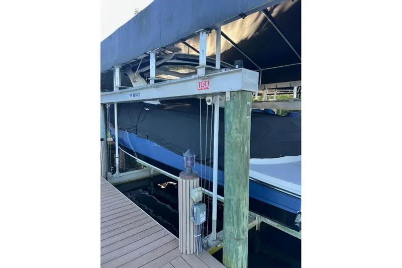 Manda Rae Too Yacht Photos Pics 2018 Sae Ray 38SLV OB boat on lift, covered and docked.