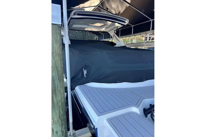 Manda Rae Too Yacht Photos Pics 2018 Sae Ray 38SLV OB boat covered, docked under a canopy.