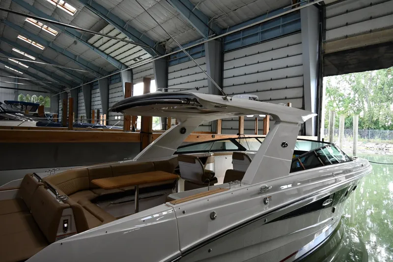  Yacht Photos Pics 2020 Sea Ray SLX 400 Outboard in a covered marina, showcasing sleek design and luxury features.
