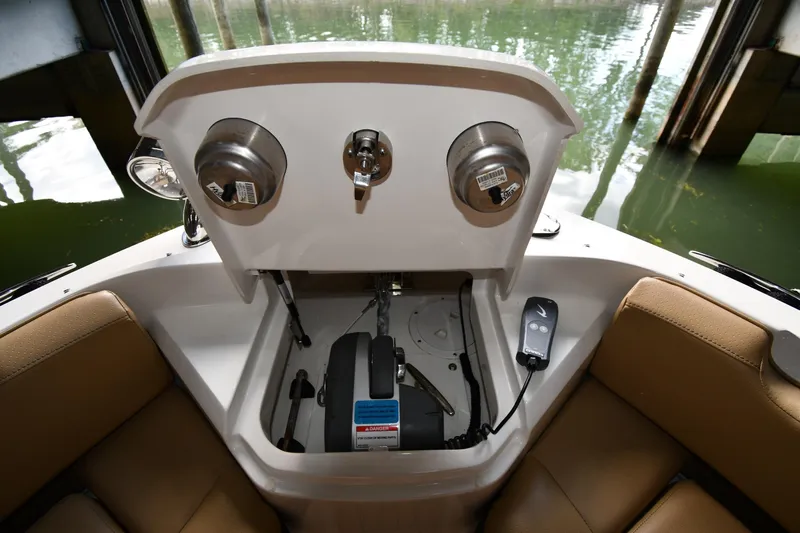  Yacht Photos Pics 2020 Sea Ray SLX 400 Outboard boat interior with storage compartment and remote control.