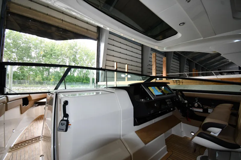  Yacht Photos Pics Interior view of 2020 Sea Ray SLX 400 Outboard boat, featuring modern helm and seating.