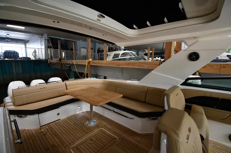  Yacht Photos Pics Luxurious interior of 2020 Sea Ray SLX 400 Outboard with elegant seating and wooden table.